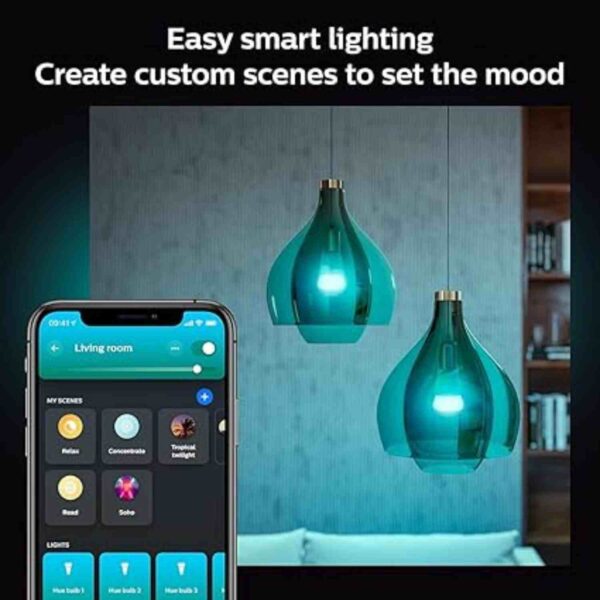 Philips Hue smart lighting system showing custom lighting scenes on a smartphone app, with two hanging teal pendant lights creating ambient lighting in a modern living room.